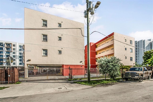 view of building exterior featuring fence