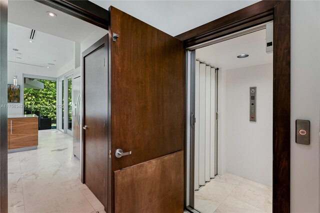 548 Fernwood Rd Unit 548, Key Biscayne, FL 33149 - hallway featuring recessed lighting and marble finish floor