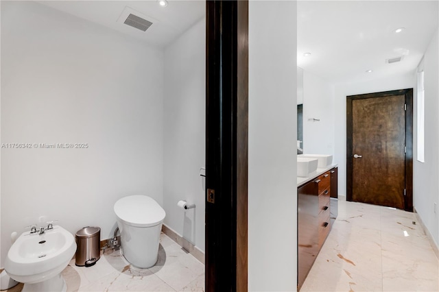 548 Fernwood Rd Unit 548, Key Biscayne, FL 33149 - bathroom with visible vents, marble finish floor, a bidet, and toilet