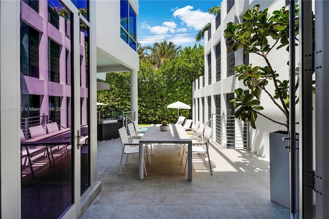 548 Fernwood Rd Unit 548, Key Biscayne, FL 33149 - view of patio featuring outdoor dining area and a balcony