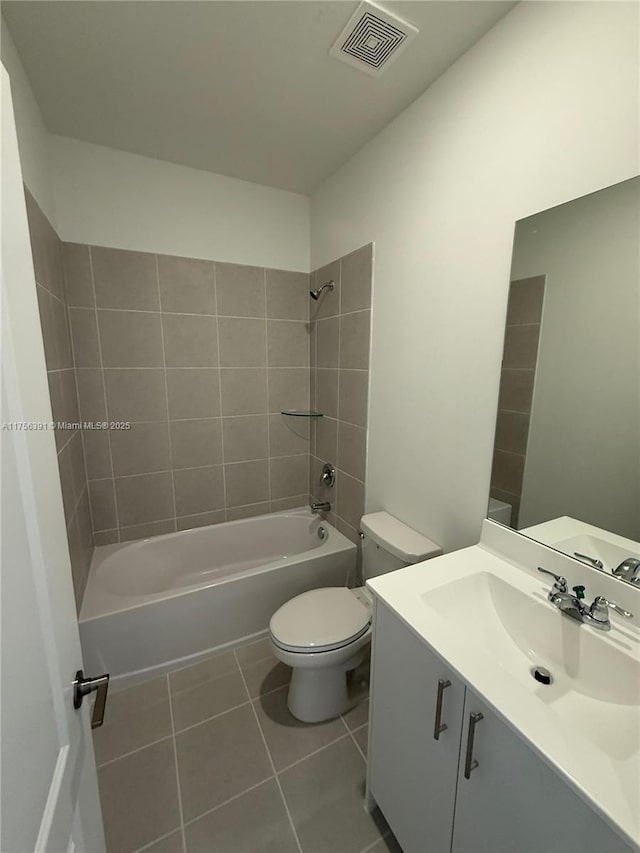 full bath featuring shower / bath combination, visible vents, toilet, vanity, and tile patterned flooring