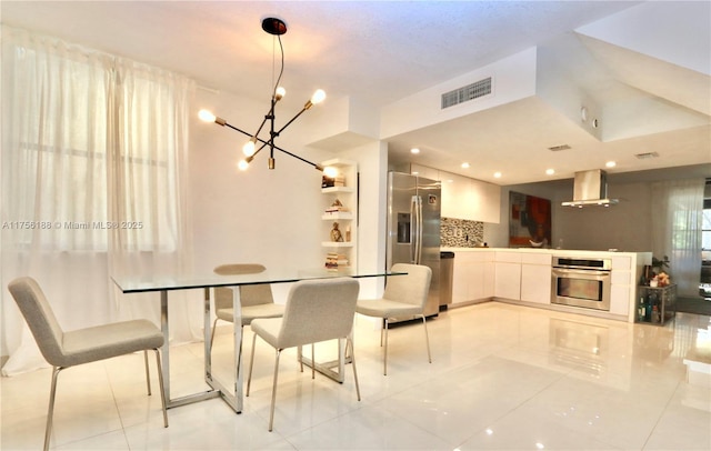 dining space with light tile patterned floors and visible vents