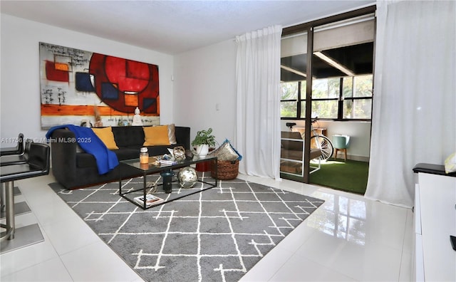 living room with tile patterned floors