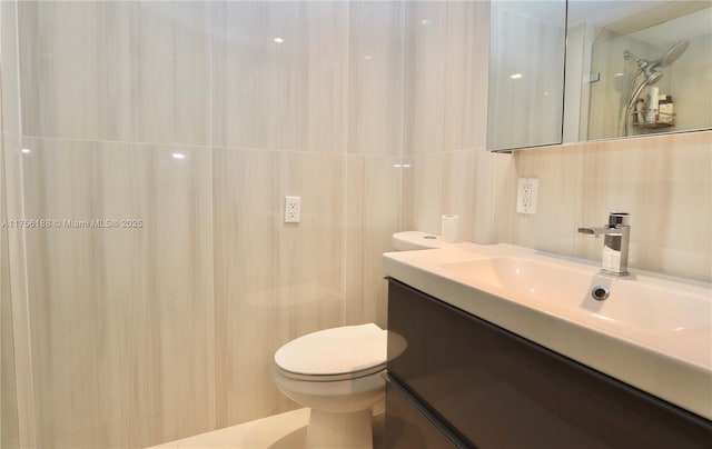 20350 W Country Club Dr Unit 104-4, Aventura, FL 33180 - bathroom featuring vanity and tile walls