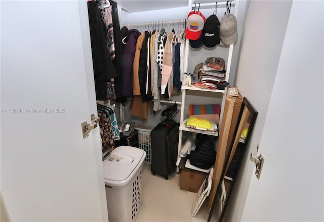 walk in closet featuring tile patterned flooring