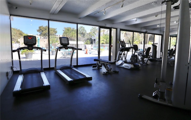 workout area with a textured ceiling