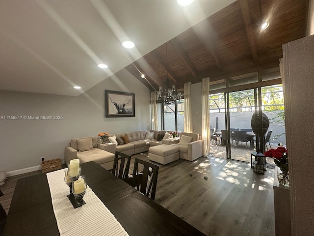 living area with baseboards, wood ceiling, wood finished floors, vaulted ceiling with beams, and a chandelier