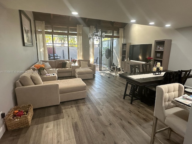 living room featuring recessed lighting, wood finished floors, and a healthy amount of sunlight