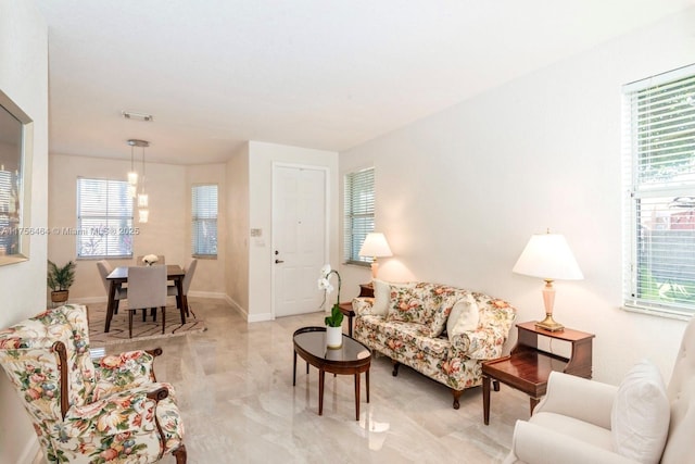 living room featuring visible vents and baseboards