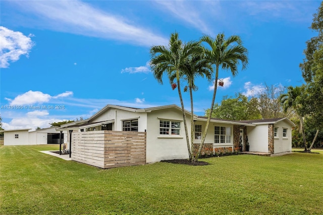 1970 SW 115th Ave, Davie, FL 33325 - rear view of house featuring a yard and stucco siding