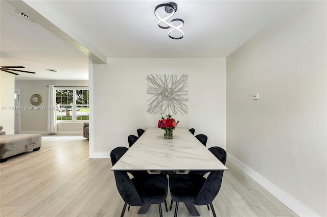 1970 SW 115th Ave, Davie, FL 33325 - dining space featuring baseboards, beam ceiling, and light wood finished floors