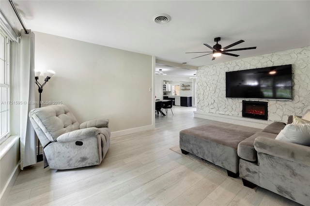 1970 SW 115th Ave, Davie, FL 33325 - living room with a ceiling fan, baseboards, visible vents, and light wood finished floors