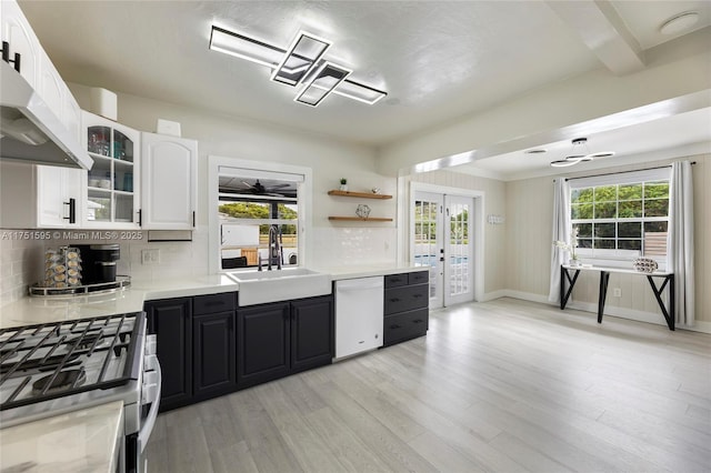 1970 SW 115th Ave, Davie, FL 33325 - kitchen featuring white cabinets, white dishwasher, gas stove, a sink, and light wood-style floors