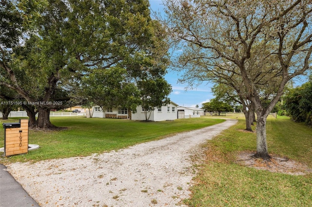 1970 SW 115th Ave, Davie, FL 33325 - view of front facade with driveway and a front yard