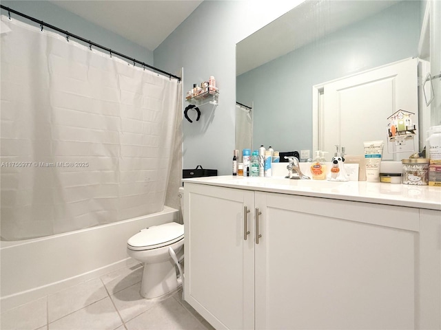 bathroom with toilet, vanity, shower / tub combo with curtain, and tile patterned floors