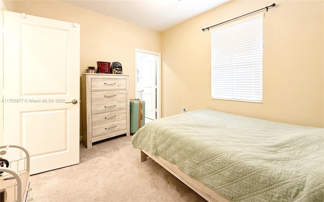 bedroom with light carpet