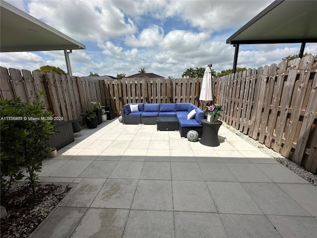 view of patio / terrace featuring outdoor lounge area and a fenced backyard