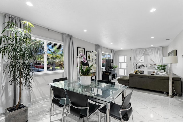 dining room with recessed lighting and light tile patterned floors