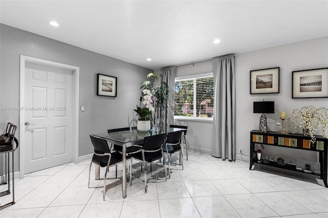 dining space featuring recessed lighting, light tile patterned floors, and baseboards