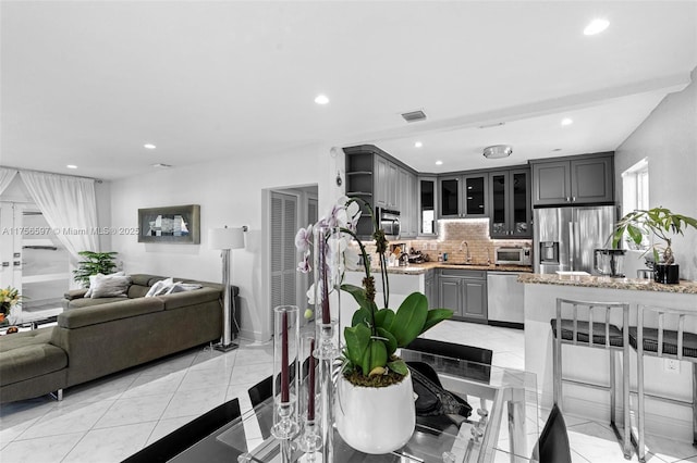 dining area featuring recessed lighting and visible vents