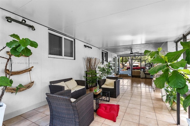 exterior space featuring outdoor lounge area and ceiling fan