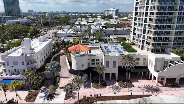 birds eye view of property with a view of city