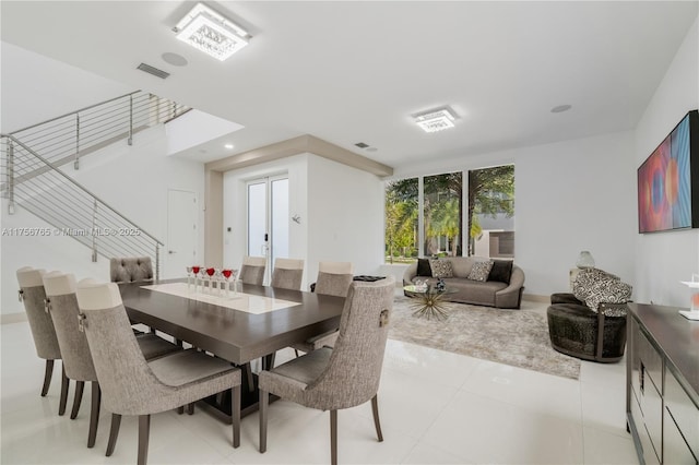 dining space with visible vents and light tile patterned flooring