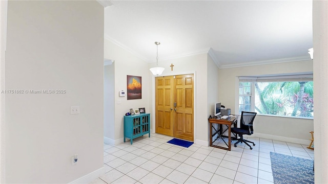 foyer entrance with light tile patterned floors, baseboards, ornamental molding, and vaulted ceiling