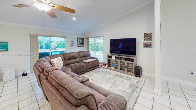 living area featuring lofted ceiling, ceiling fan, light tile patterned floors, baseboards, and crown molding