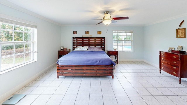 bedroom featuring light tile patterned floors, baseboards, and crown molding