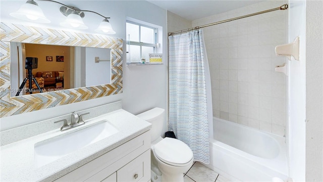 full bath featuring toilet, tile patterned floors, shower / bath combo, and vanity