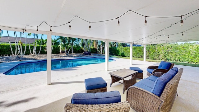 view of swimming pool featuring a patio, an outdoor living space, and a fenced in pool