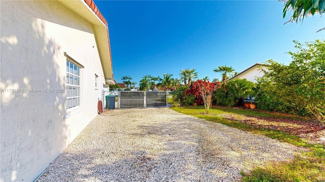 view of yard with a gate and fence