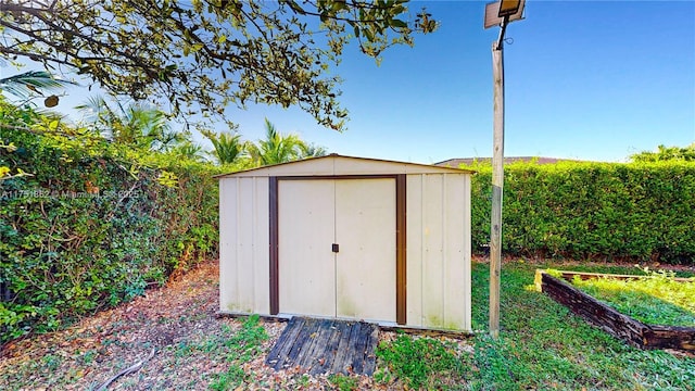 view of shed with a vegetable garden