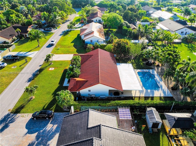 birds eye view of property with a residential view