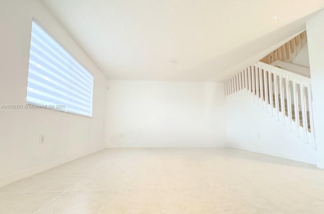 spare room featuring tile patterned floors