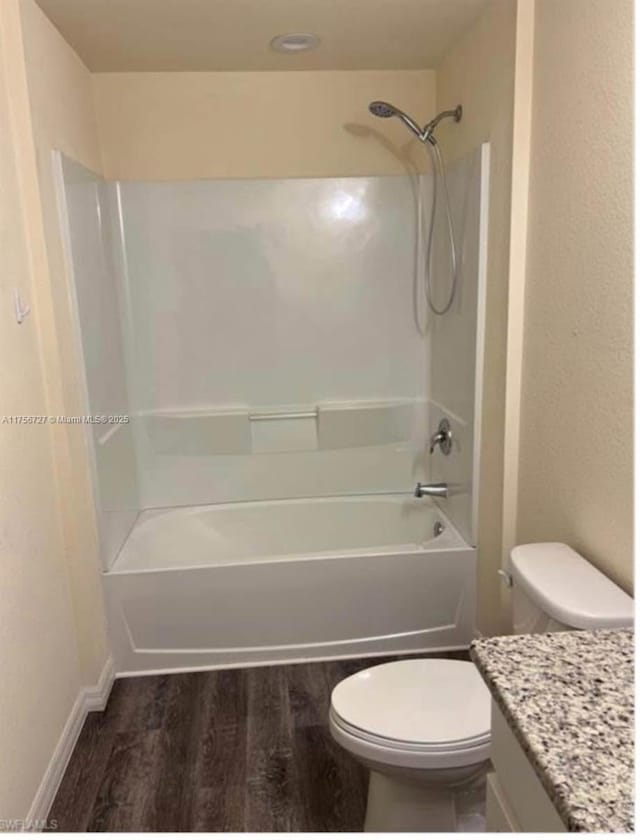 full bathroom with  shower combination, vanity, toilet, and wood finished floors