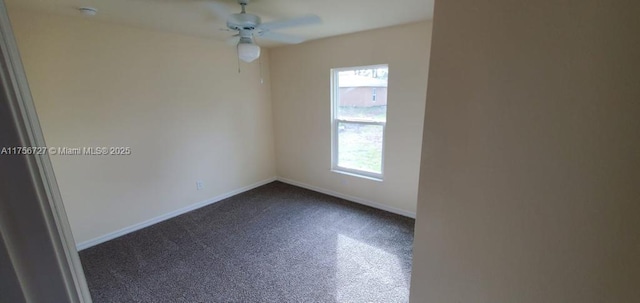 empty room with ceiling fan and baseboards