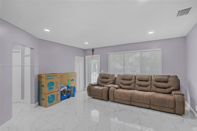 living room featuring marble finish floor, baseboards, visible vents, and recessed lighting