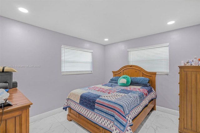 bedroom featuring recessed lighting, marble finish floor, and baseboards