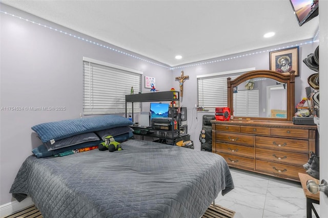 bedroom featuring recessed lighting and marble finish floor