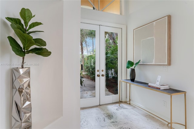 doorway to outside with french doors and tile patterned floors