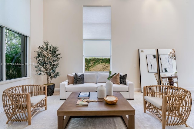 living area featuring baseboards