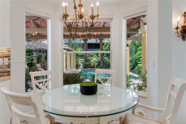 dining space with a notable chandelier