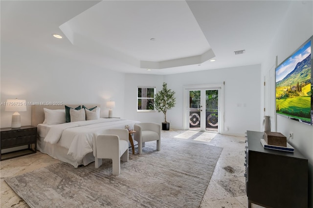 bedroom featuring baseboards, visible vents, a raised ceiling, and recessed lighting