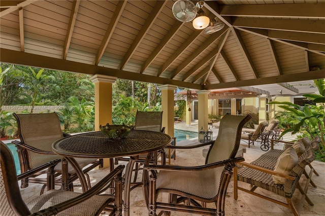 view of patio / terrace with outdoor dining space and an outdoor pool