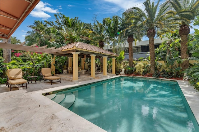 outdoor pool with a patio area