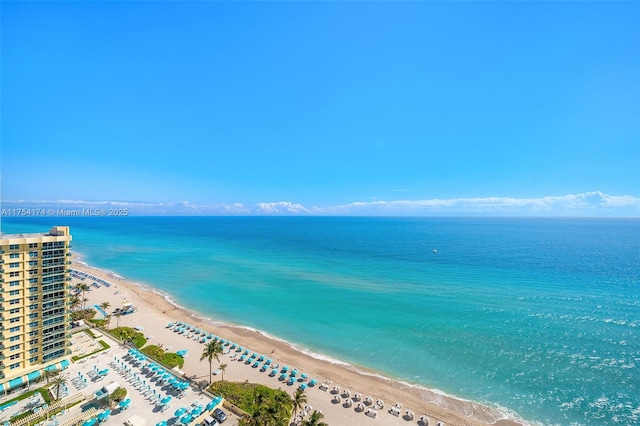 drone / aerial view featuring a view of the beach and a water view