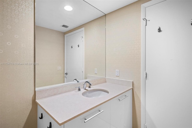 bathroom featuring visible vents and vanity