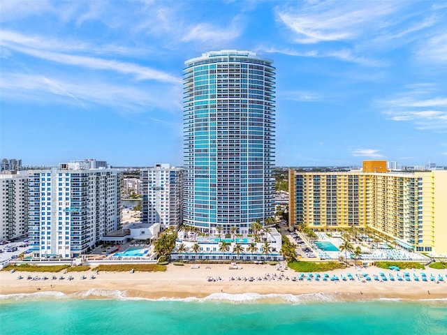 bird's eye view with a city view, a view of the beach, and a water view